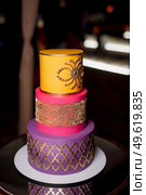 wedding tiered cake in multicolored maracan style colors. Стоковое фото, агентство Ingram Publishing / Фотобанк Лори
