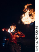 light up the night fire show with the participation of the people, light, and open fire. Стоковое фото, агентство Ingram Publishing / Фотобанк Лори