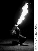 light up the night fire show with the participation of the people, light, and open fire. Стоковое фото, агентство Ingram Publishing / Фотобанк Лори