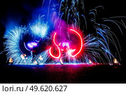 fiery pieces of a fire show against a dark sky and thunderstorms. Стоковое фото, агентство Ingram Publishing / Фотобанк Лори
