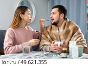 Sick man sitting with wife at home. Стоковое фото, фотограф Яков Филимонов / Фотобанк Лори