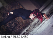 girl model in black with pink hair in an abandoned building. Стоковое фото, агентство Ingram Publishing / Фотобанк Лори