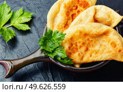 Cheburek, a dish of unleavened dough stuffed with minced meat. Crimean Tatar cuisine. Traditional homemade pasties, cheburek. Стоковое фото, агентство Ingram Publishing / Фотобанк Лори
