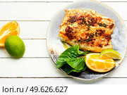 Tasty baked fish, fried pike perch in orange sauce.. Roasted fish fillets. Стоковое фото, агентство Ingram Publishing / Фотобанк Лори