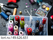 Collection threads, needles, buttons and seamstress tools. Handiwork set. A set of accessories for needlework. Стоковое фото, агентство Ingram Publishing / Фотобанк Лори
