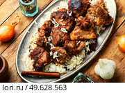 Spicy vindaloo meat with rice. Pork cooked in spicy garlic sauce. Vindaloo, meat in roast spices. Стоковое фото, агентство Ingram Publishing / Фотобанк Лори