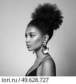 Beautiful smiling girl with curly hairstyle stock photo Women, African Ethnicity, Fashion Model, One Woman Only. Black and white photo. Стоковое фото, агентство Ingram Publishing / Фотобанк Лори