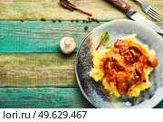 Appetizing beef stroganoff meat. Meat with mushrooms and mashed potatoes. Space for text, recipe place. Meat with mushrooms, Beef stroganoff. Стоковое фото, агентство Ingram Publishing / Фотобанк Лори