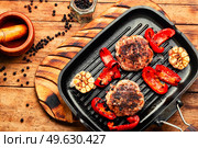 Beefsteak, beef and pork marinated in juniper berries.. Fried beefsteak in bacon. Стоковое фото, агентство Ingram Publishing / Фотобанк Лори