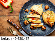 Roast squid stuffed with mushrooms and bell pepper. Grilled seafood. Grilled squid with mushroom stuffing. Стоковое фото, агентство Ingram Publishing / Фотобанк Лори