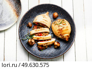 Fried squid stuffed with mushrooms and sweet peppers.. Tasty grilled squid with vegetable stuffing. Стоковое фото, агентство Ingram Publishing / Фотобанк Лори