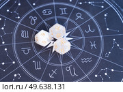 Horoscope zodiac circle with divination dice, top view. Fortune telling and astrology predictions concept, magic rituals and exoteric experience. Zodiac horoscope with divination dice. Стоковое фото, агентство Ingram Publishing / Фотобанк Лори