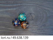 Divination dice. Fortune telling and astrology predictions concept, magic rituals and exoteric experience. Zodiac horoscope with divination dice. Стоковое фото, агентство Ingram Publishing / Фотобанк Лори