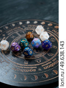Horoscope zodiac circle with divination dice. Fortune telling and astrology predictions concept, magic rituals and exoteric experience. Zodiac horoscope with divination dice. Стоковое фото, агентство Ingram Publishing / Фотобанк Лори