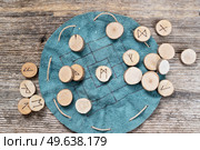 Handmade runes for fortunetelling over leather chart. Handmade runes for fortunetelling. Стоковое фото, агентство Ingram Publishing / Фотобанк Лори