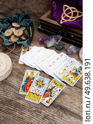 Fortune telling on tarot cards, used Marseille Tarot deck by unknown artist published first in 1709. Fortune telling on tarot cards. Стоковое фото, агентство Ingram Publishing / Фотобанк Лори