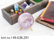 Gemstones set for relax and meditation. Magic ball made of Amestist stone and minerals for Reiki life balance, healing Crystal Ritual, Witchcraft, spiritual esoteric practice.. Healing crystals concept. Стоковое фото, агентство Ingram Publishing / Фотобанк Лори