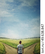 Conceptual painting with a doubtful person at a crossroad choosing the correct path between left and right. The road to success, way choice concept. Difficult decision, life dilemma. Стоковое фото, агентство Ingram Publishing / Фотобанк Лори