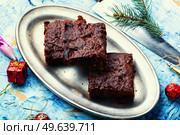 Panforte, an unusually delicious Christmas treat made from dried fruits and nuts. Panforte, Tuscan pie. Panforte is a traditional Italian Christmas torte. Стоковое фото, агентство Ingram Publishing / Фотобанк Лори