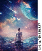 Wonderful cosmic painting with a person in the ocean of space. Surreal scene, starry night sky on another planet and a wanderer walks in the water watching the crescent moon, meteor shower and nebulas. Стоковое фото, агентство Ingram Publishing / Фотобанк Лори