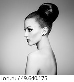 Black and white fashion art studio portrait of beautiful elegant woman.  Elegant ballet style. Hair is collected in high beam. Стоковое фото, агентство Ingram Publishing / Фотобанк Лори