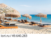summer beach with sunbeds, Mykonos island, Greece. Mykonos island, Greece. Стоковое фото, агентство Ingram Publishing / Фотобанк Лори