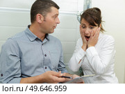 woman shocked and surprised with the bills. Стоковое фото, агентство Ingram Publishing / Фотобанк Лори