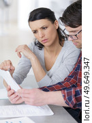 young couple receiving foreclosure notice letter. Стоковое фото, агентство Ingram Publishing / Фотобанк Лори