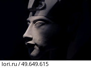 bust of pharaoh Echnaton (Akhenaten, aka Amenhotep IV) around black background . cloes up. Стоковое фото, агентство Ingram Publishing / Фотобанк Лори