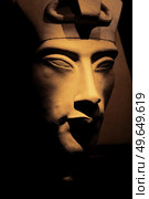 bust of pharaoh Echnaton (Akhenaten, aka Amenhotep IV) around black background . cloes up. Стоковое фото, агентство Ingram Publishing / Фотобанк Лори