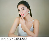 Portrait beautiful young woman with clean fresh skin. Model with healthy skin, close up portrait. Cosmetology, beauty and spa. Film photography. Стоковое фото, агентство Ingram Publishing / Фотобанк Лори