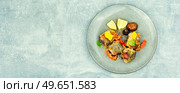 Fried hake fish with tomato and mushrooms on the plate, space for text. Fish baked with mushrooms. Стоковое фото, агентство Ingram Publishing / Фотобанк Лори