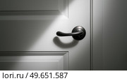 Light shines on a door handle in a dimly lit hallway during evening hours. В вечерние часы свет падает на дверную ручку в тускло освещенном коридоре. Стоковое AI-изображение, AI-художник Katsiaryna Repich / Фотобанк Лори