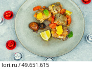 Fish hake cooked with mushrooms, orange and tomatoes. Christmas food. Fish hake prepared with mushrooms and oranges. Стоковое фото, агентство Ingram Publishing / Фотобанк Лори