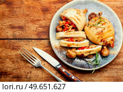 Appetizing fried squids with vegetable stuffing. Roasted stuffed squid. European cuisine. Grilled squid with vegetables, stuffed calamari. Стоковое фото, агентство Ingram Publishing / Фотобанк Лори
