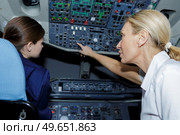 2 female pilots during training. Стоковое фото, агентство Ingram Publishing / Фотобанк Лори
