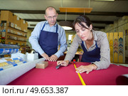 female artisan working on the decoration of a frame. Стоковое фото, агентство Ingram Publishing / Фотобанк Лори