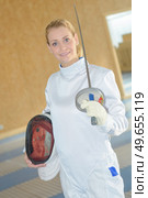 portrait of a woman in fencing gear. Стоковое фото, агентство Ingram Publishing / Фотобанк Лори
