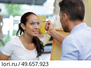 a woman having the eyes tested. Стоковое фото, агентство Ingram Publishing / Фотобанк Лори