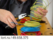 close up electrician wiring at site. Стоковое фото, агентство Ingram Publishing / Фотобанк Лори