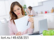 a woman has received a notice. Стоковое фото, агентство Ingram Publishing / Фотобанк Лори