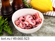 Marinated baby octopus snack appetizer. Стоковое фото, фотограф Андрей Старостин / Фотобанк Лори
