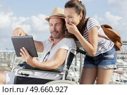 cheerful couple in the wheelchairs outdoors. Стоковое фото, агентство Ingram Publishing / Фотобанк Лори