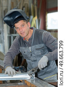 professional welder during his shift in the factory. Стоковое фото, агентство Ingram Publishing / Фотобанк Лори