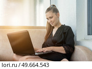 Relaxed Morning Productivity Lady Working Remotely on Her Laptop. Стоковое фото, фотограф Aleksandr Golubev / Фотобанк Лори