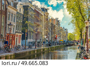 Ancient streets and canals in the city center of Amsterdam. Netherlands. Стоковое фото, агентство Ingram Publishing / Фотобанк Лори
