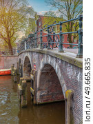 Traditional old buildings in Amsterdam, the Netherlands. Стоковое фото, агентство Ingram Publishing / Фотобанк Лори