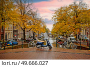Autumn sunset in the city of Amsterdam. Netherlands. Стоковое фото, агентство Ingram Publishing / Фотобанк Лори