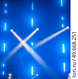rays of light illuminate the scene at the concert. Стоковое фото, агентство Ingram Publishing / Фотобанк Лори