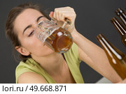 woman drinking beer at bar or pub. Стоковое фото, агентство Ingram Publishing / Фотобанк Лори